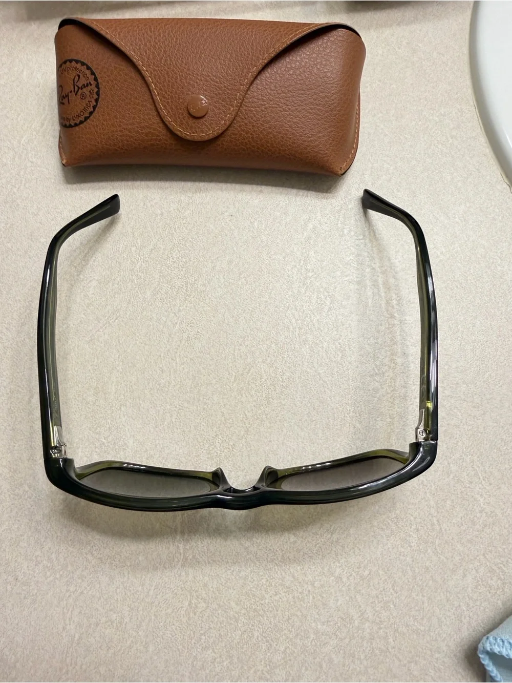 Maui Jim Black Frame Sunglasses with Green-Tinted Lenses